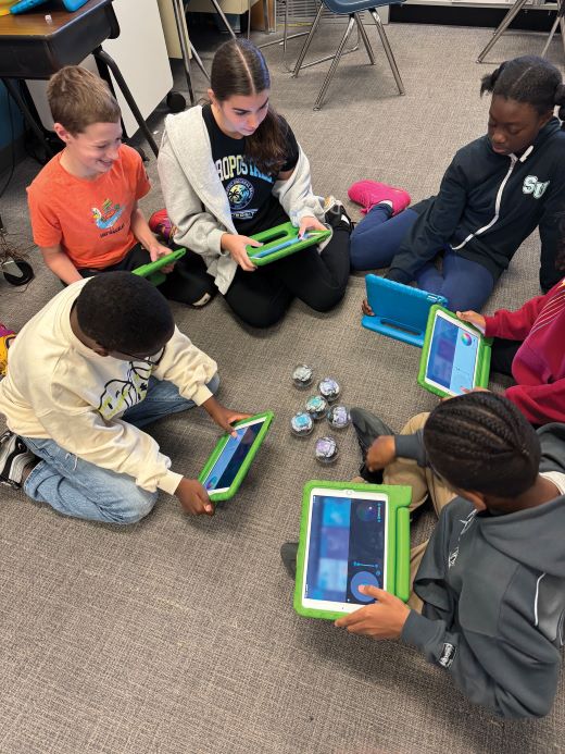 Kids looking at tablets